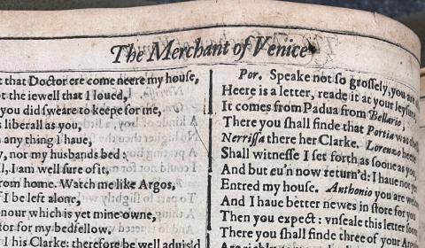 Close up of the title line "The Merchant of Venice" with an ink blot after the "e" in Venice