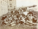 a black and white photograph of the football Team of 1898. the group is pictured in front of Healy hall.