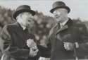a black and white photograph of Andrew “Cy" Cummings and Georgetown University President Arthur A. O’Leary, S.J. at the Georgetown v. Maryland game, November 1935