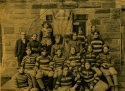 a photograph of the Prep team of 1898, posing in front of healy hall.