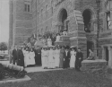 Visitors from the Visitation Academy and Georgetown students on the steps of Healy Hall, 1911