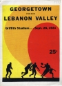 the cover of a Georgetown vs Lebanon Valley Game Program, 1931. the cover depicts a print in ink of four football players in silhouette against a yellow, orange, and red background with text at the top of the program.