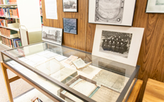 Display case in the Woodstock Theological Library holding a variety of artifacts.