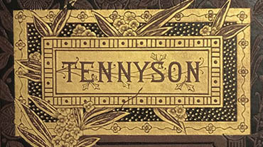 Ornate gilded cover of a book, showing flowers and the name Tennyson