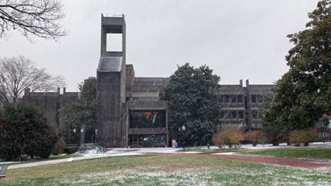 Front entrance of Lauinger Library in a snowfall.