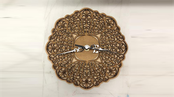 Laser cut clock was designed based on a 19th-century Cuban comb from the Smithsonian archives