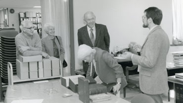 Nicholas Scheetz (right) shows the Library's original Tom Sawyer manuscript to (from left) Joseph Jeffs, Jeannine Jeffs, Graham Greene, and Yvonne Cloetta