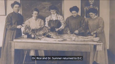 Screencap from "More to the Story" showing early women students at Georgetown examining a cadaver