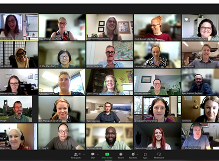 A grid of the video feeds of 25 library employees participating in a virtual meeting in Zoom