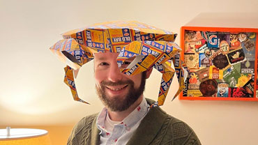 Jay Sylvestre in a crab hat made from paper