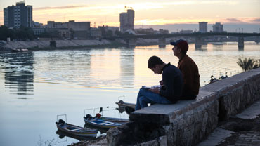 Students on the bank of the Tigris River