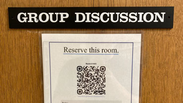 QR code on the door to a group discussion room.