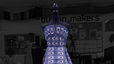 A dress made of blue coffee cup sleeves from the Corp.