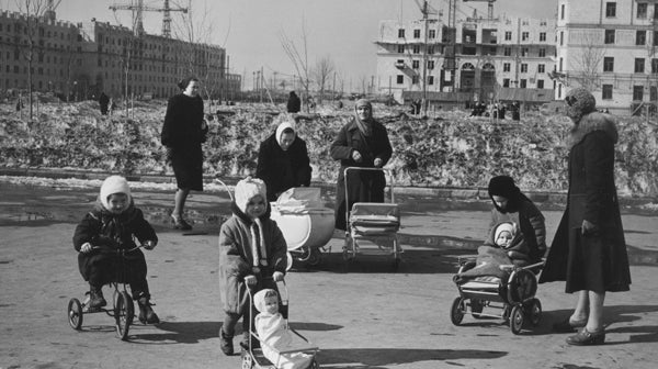 Black and white image of a group of women and children.