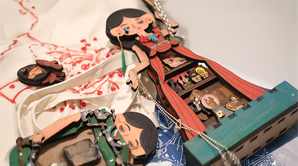 a painted wooded statue lying on its back