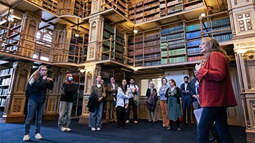 Students on a tour of the historic Riggs Library