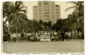 a black and white photograph of Orange Bowl squad and coaches outside The Flamingo hotel in Miami Beach