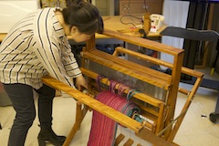 Student Working with Loom
