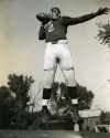 a black and white portrait of Lou Falcone, Quarterback and Halfback 1939-1941, in football uniform