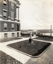 “Infirmary Garden” and the west side of Ryan Hall, after 1904 and before 1913 