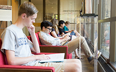Students reading and studying on the 5th floor of Lauinger Library.