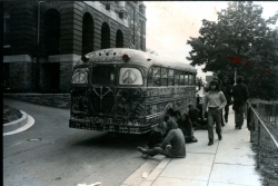 Black and white photograph of protestors' VW van on campus