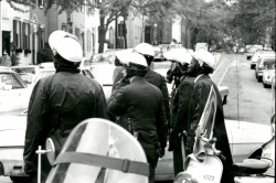 Black and white photograph of police in riot gear on Prospect street near 37th street