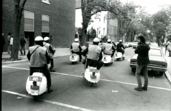 Black and white photograph of police scooters on Prospect Street