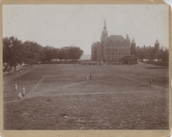 Sepia-toned photograph showing a baseball game on the University's front lawn