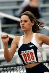 Color photographs showing Aimee Mullins competing in a GU athletic uniform