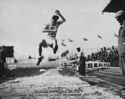 Black and white photograph of LeGendre in mid-jump while competing at the 1924 Olympics