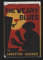 Dust jacket of The Weary Blues, showing a man playing the piano with his head raised, with a gas light illuminating the scene