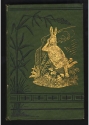The front cover of Uncle Remus his songs and his sayings, with rabbit smoking a long pipe in gold on a green background