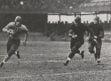 a black and white photograph of Quarterback Tom Keating in action against Manhattan, 1936