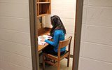 A student reads in an individual study room