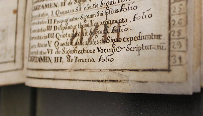 book page with handwritten Latin text after conservation treatment