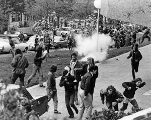 Image of people running near Lauinger Library as tear gas is released in the vacinity during the May Day demonstrations in Washington, D.C. in 1971