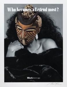 A woman wearing a mask decorated with cowrie shells, white jewelry, and black clothing sits with her hand resting on her chin, her face obscured by the mask. The sentence "Who becomes a Legend most" is printed at the top of the print.
