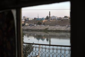 Color photo showing the view of the Tigris River from a window.