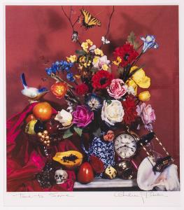 Print of a vase of flowers on a tabletop with other objects like fruits and clocks. 