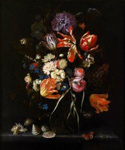 Vase of flowers on a surface with some seashells around it.