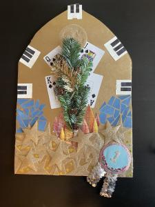 Multi-media collage on posterboard: wire, magazine clippings, faux flowers