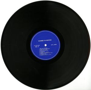Vinyl record for the Senior Show performance of "Banned In Boston" performed in 1956. The record is black with a blue label.