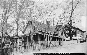 A black and white photo of Prospect Cottage taken from the southeast, showing ornamental eaves and wrap around porch