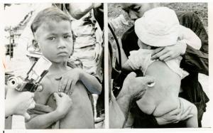 Double photo in black and white. A Vietnamese boy on the left receives an injection in the right arm, and a baby on the right is held back to viewer while a doctor administers an injection.