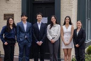 Color photograph of Fellows outside the Mortara Building