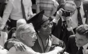 B X W photo of Pearl Bailey dressed in commencement regalia and hugging her professor
