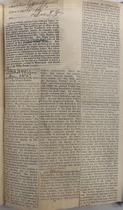 Scrapbook with newspaper columns pasted on a page