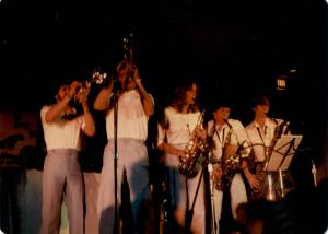 Photograph of trumpet and saxophone players
