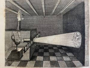 Engraving of an early projector, projecting an image of hell on a wall